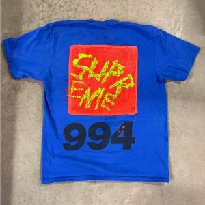 Supreme Blue Tee with Red and Yellow Graphic